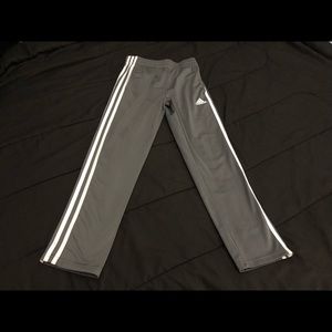 grey Adidas pants.